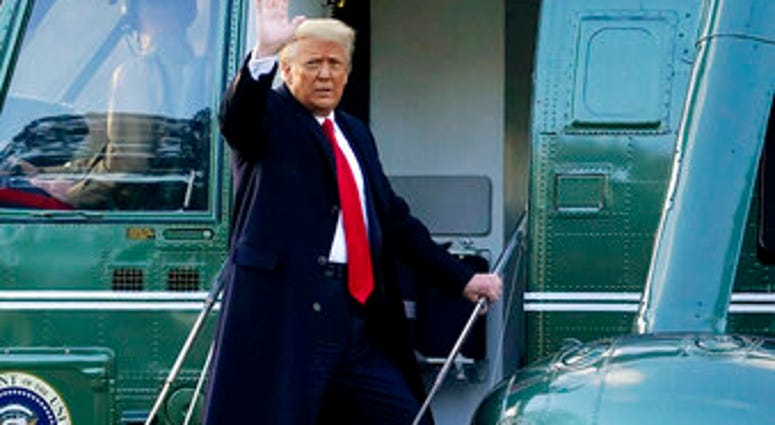 FILE - In this Wednesday, Jan. 20, 2021, file photo, President Donald Trump waves as he boards Marine One on the South Lawn of the White House, in Washington. (AP Photo/Alex Brandon, File) FILE - In this Wednesday, Jan. 20, 2021, file photo, President Donald Trump waves as he boards Marine One on the South Lawn of the White House, in Washington. (AP Photo/Alex Brandon, File)