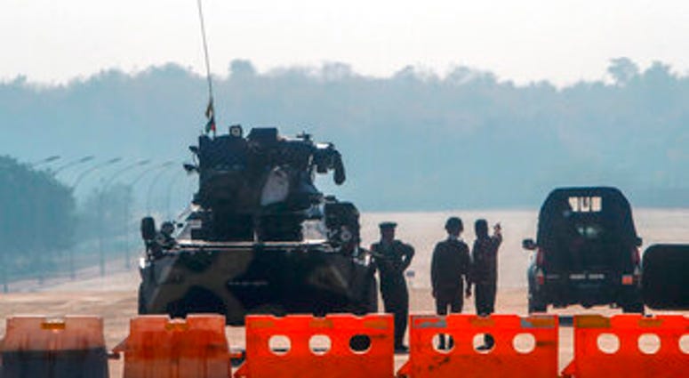 Myanmar's military stand guard at a checkpoint manned with an armored vehicle in a road leading to the parliament building Tuesday, Feb. 2, 2021, in Naypyitaw, Myanmar. (AP Photo) Myanmar's military stand guard at a checkpoint manned with an armored vehicle in a road leading to the parliament building Tuesday, Feb. 2, 2021, in Naypyitaw, Myanmar. (AP Photo)