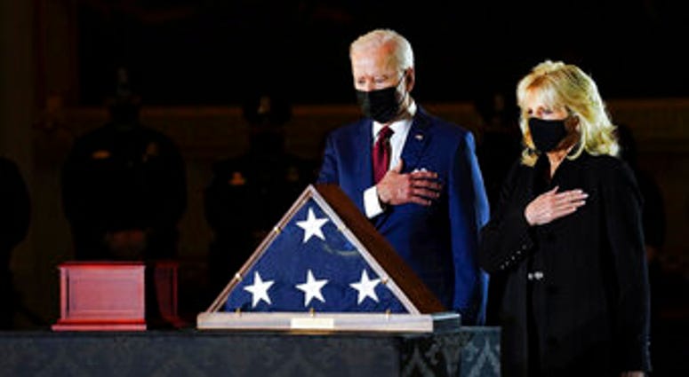 President Joe Biden and first lady Jill Biden pay their respects to the late U.S. Capitol Police officer Brian Sicknick. (Erin Schaff/The New York Times via AP, Pool) President Joe Biden and first lady Jill Biden pay their respects to the late U.S. Capitol Police officer Brian Sicknick. (Erin Schaff/The New York Times via AP, Pool)