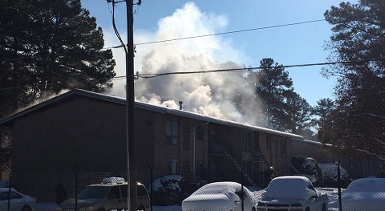 Henrico Firefighters fight a fire at the Carriage Hill apartments off Bremner Road on December 11, 2018. (Matt Demlein, WRVA)