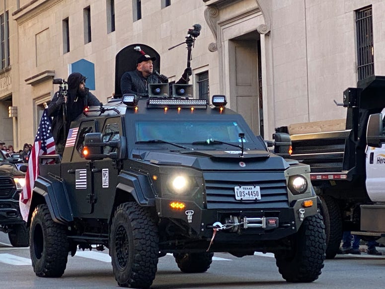 Conservative Talk Host Alex Jones rides through streets of Richmond in a military syle vehicle. (Jay Hart, WINA) Conservative Talk Host Alex Jones rides through streets of Richmond in a military syle vehicle. (Jay Hart, WINA)