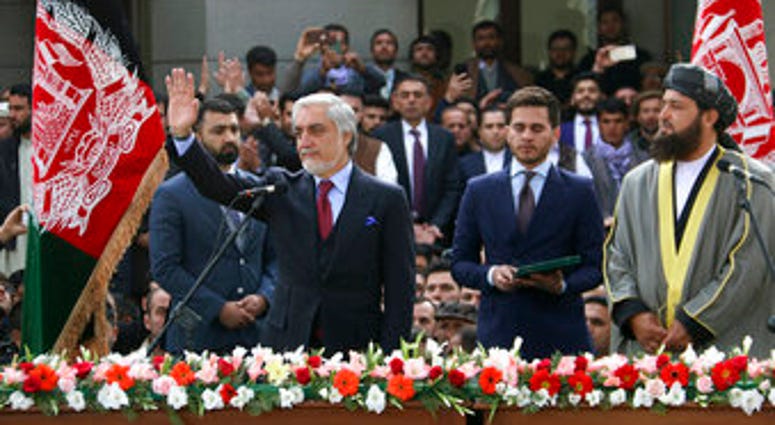 In this Monday, March 9, 2020, photo, Afghanistan's Abdullah Abdullah, front left, greets his supporters after being sworn in as president in Kabul, Afghanistan. (AP Photo) In this Monday, March 9, 2020, photo, Afghanistan's Abdullah Abdullah, front left, greets his supporters after being sworn in as president in Kabul, Afghanistan. (AP Photo)