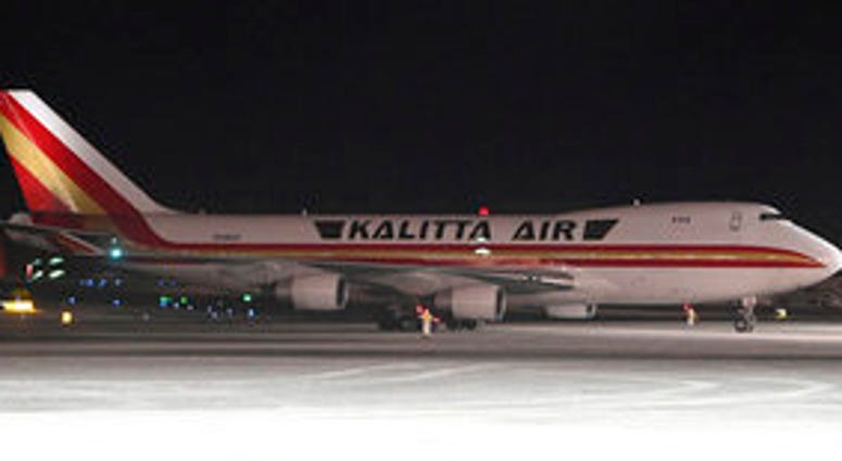 An airplane, background, carrying U.S. citizens being evacuated from Wuhan, China, makes a refueling stop at the north terminal at Ted Stevens Anchorage International Airport in Anchorage, Alaska. (Bill Roth/Anchorage Daily News via AP) An airplane, background, carrying U.S. citizens being evacuated from Wuhan, China, makes a refueling stop at the north terminal at Ted Stevens Anchorage International Airport in Anchorage, Alaska. (Bill Roth/Anchorage Daily News via AP)