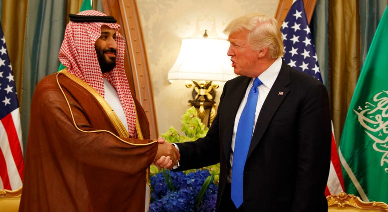 FILE - In this May 20, 2017, file photo, President Donald Trump shakes hands with Saudi Deputy Crown Prince and Defense Minister Mohammed bin Salman in Riyadh. In emails obtained by The Associated Press, George Nader claims he later met with Mohammed bin