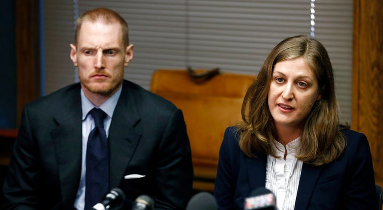 Rita Bettis, right, American Civil Liberties Union of Iowa Legal Director, speaks during a news conference as Emma Goldman Clinic attorney Sam Jones, left, looks on, Friday, June 1, 2018, in Des Moines, Iowa. A judge says he'll temporarily block the most