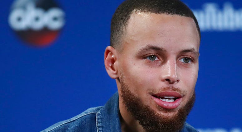 Golden State Warriors guard Stephen Curry speaks at a news conference after Game 2 of basketball's NBA Finals between the Warriors and the Cleveland Cavaliers in Oakland, Calif., Sunday, June 3, 2018. The Warriors won 122-103. (AP Photo/Ben Margot)