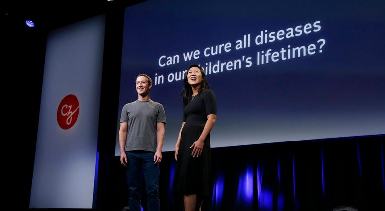 FILE- In this Sept. 20, 2016, file photo, Facebook CEO Mark Zuckerberg and his wife, Priscilla Chan, prepare for a speech in San Francisco. The Giving USA report, released Tuesday, June 12, 2018, said giving from individuals, estates, foundations and corp