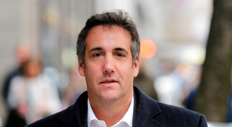 FILE - In this April 11, 2018, file photo, Michael Cohen, President Donald Trump's personal attorney, walks along a sidewalk in New York. Cohen is searching for a new legal team to represent him in an FBI investigation of his business dealings. A person f