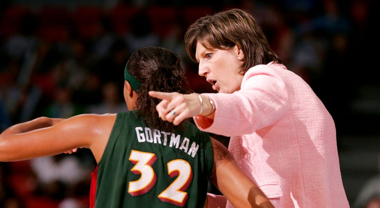 FILE - In this June 15, 2006, file photo, Seattle Storm coach Anne Donovan, right, talks to Shaunzinski Gortman during the fourth quarter of the team's WNBA basketball game against the Chicago Sky in Chicago. The Storm won 74-61. Donovan, the Basketball H