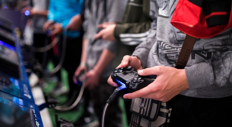 - In this Friday, Nov. 3, 2017 file photo, a man plays a game at the Paris Games Week in Paris.