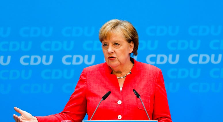 German Chancellor Angela Merkel attends a news conference after a leaders meetings of her Christion Democratic Union party at the party's headquarters in Berlin, Monday, June 18, 2018. (AP Photo/Markus Schreiber)