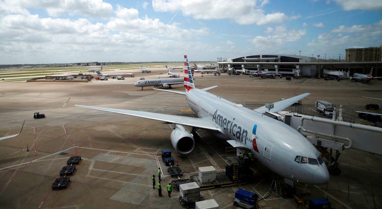 In this June 16, 2018 photo, American Airlines aircrafts are seen at Dallas-Fort Worth International Airport in Grapevine, Texas. (AP Photo/Kiichiro Sato) In this June 16, 2018 photo, American Airlines aircrafts are seen at Dallas-Fort Worth International Airport in Grapevine, Texas. (AP Photo/Kiichiro Sato)
