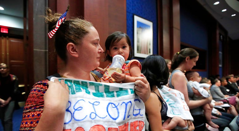 Lucy Martin and her daughter Branwen Espinal together with other mothers and their babies.(AP Photo/Manuel Balce Ceneta) Lucy Martin and her daughter Branwen Espinal together with other mothers and their babies.(AP Photo/Manuel Balce Ceneta)