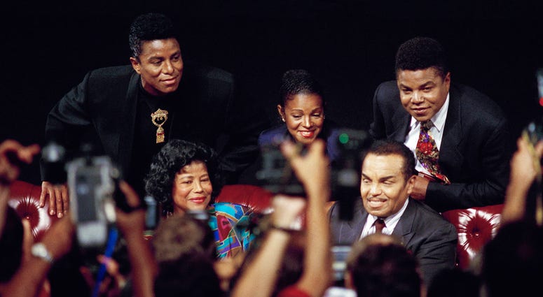 FILE - In this Aug. 30, 1993 file photo, members of the Jackson family, from left, Jermaine Jackson, mother Katherine Jackson, Rebbie Jackson, Joe Jackson, foreground right, and Tito Jackson appear at a press conference in Los Angeles to promote their ben