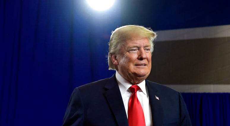 President Donald Trump prepares to speak at a rally at Airport High School in West Columbia, S.C., Monday, June 25, 2018, for Republican Gov. Henry McMaster. (AP Photo/Susan Walsh)