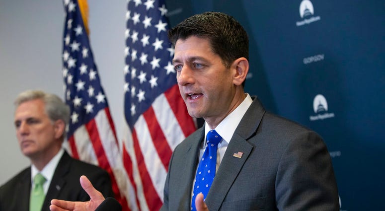 Speaker of the House Paul Ryan, R-Wis., joined by Majority Leader Kevin McCarthy, R-Calif., left, talks to reporters following a GOP strategy session at the Capitol in Washington, Tuesday, June 26, 2018. A far-reaching Republican immigration bill is caree