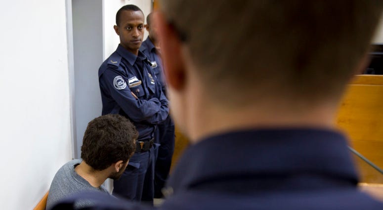 In this April 20, 2017 photo, dual U.S.-Israeli citizen, Michael Ron David Kadar, sits during a court session, in Rishon Lezion, Israel. An Israeli court on Thursday, June 28, 2018, convicted Kadar, for making a string of bomb threats targeting U.S. Jewis