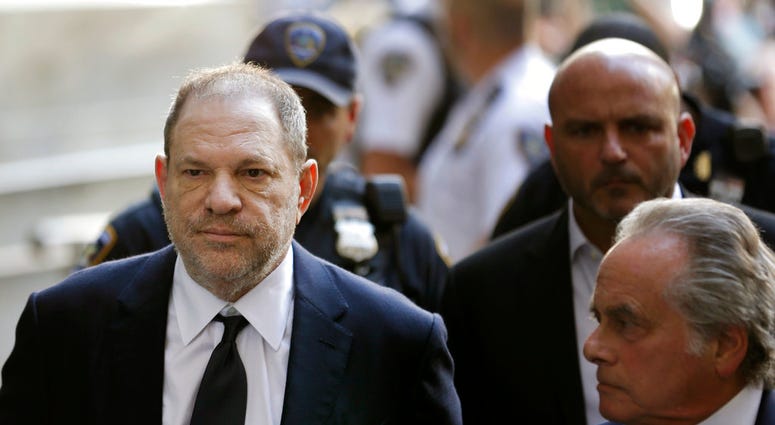 FILE - In this June 5, 2018, file photo, Harvey Weinstein arrives to court in New York. Weinstein has been accused of a forcible sex act by a third woman in an updated indictment. District Attorney Cyrus R. Vance Jr. announced the indictment Monday, July