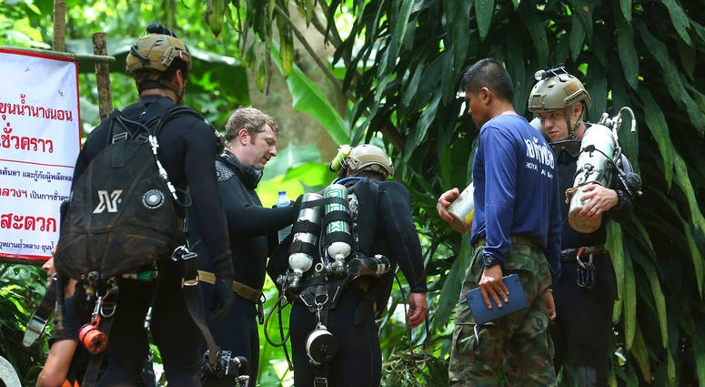 Thai rescuers outside flooded cave