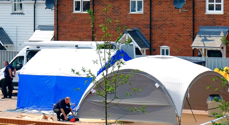Police at the scene where counter-terrorism officers are investigating after a couple were left in a critical condition, in Amesbury, England, Thursday, July 5, 2018. For the second time in four months, two people lie critically ill in England's Salisbury