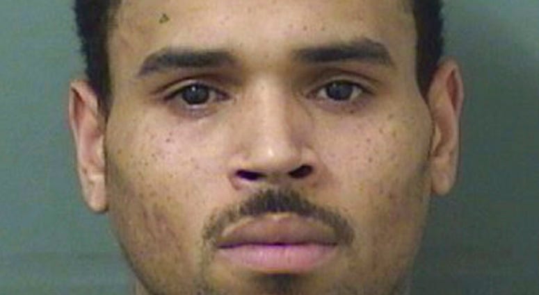 This booking photo provided by Balm Beach County Sheriff's Office shows Chris Brown. The singer walked off stage after his concert in Florida and into the hands of waiting sheriff’s deputies, who arrested him on a felony battery charge and booked him into