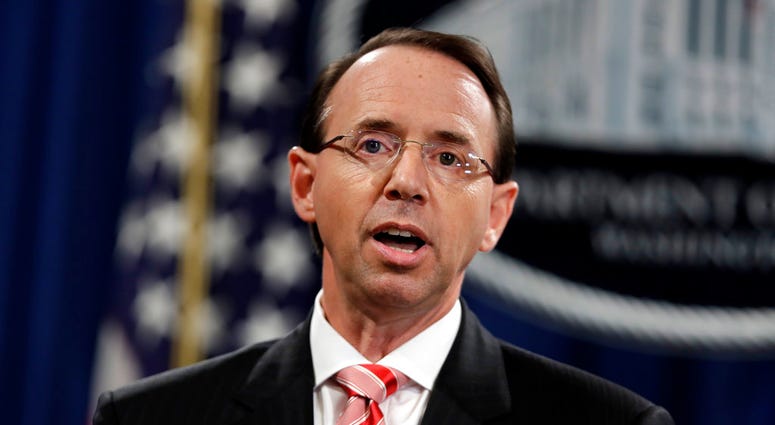 Deputy Attorney General Rod Rosenstein speaks during a news conference at the Department of Justice, Friday, July 13, 2018, in Washington. (AP Photo/Evan Vucci)