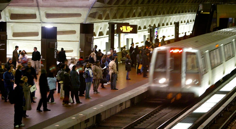 In a Monday, April 5, 2004 file photo, riders wait to board an arriving train at the D.C. Metro Center, in Washington. (AP Photo/Lawrence Jackson, File)
