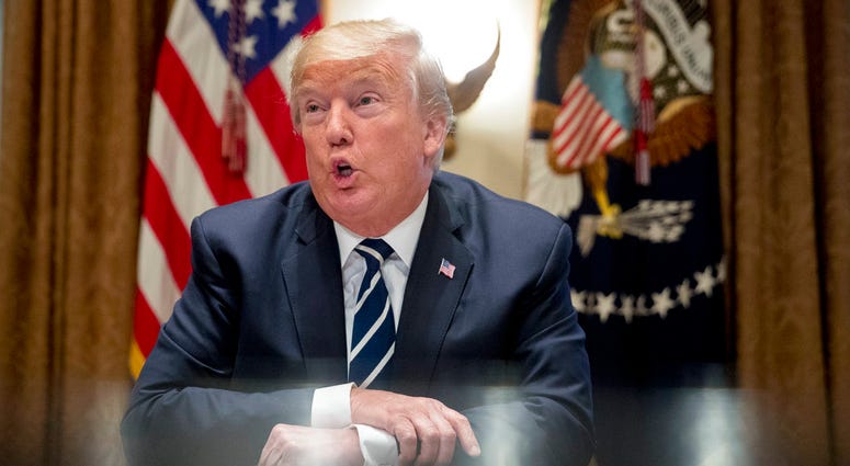 President Donald Trump speaks to members of the media as he meets with members of Congress in the Cabinet Room of the White House, Tuesday, July 17, 2018, in Washington. (AP Photo/Andrew Harnik)