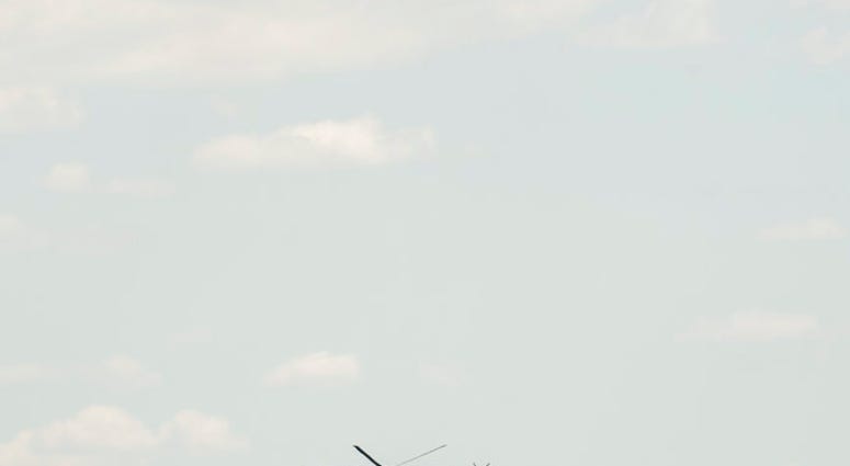 The Jefferson Memorial is visible behind Marine One, top, with President Donald Trump and first lady Melania Trump aboard, as it arrives on the South Lawn of the White House in Washington, Wednesday, July 18, 2018. (AP Photo/Andrew Harnik) The Jefferson Memorial is visible behind Marine One, top, with President Donald Trump and first lady Melania Trump aboard, as it arrives on the South Lawn of the White House in Washington, Wednesday, July 18, 2018. (AP Photo/Andrew Harnik)