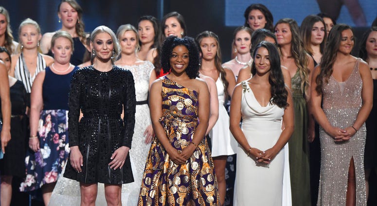 (Photo by Phil McCarten/Invision/AP) Former gymnast Sarah Klein, former Michigan State softball player Tiffany Thomas Lopez and gymnast Aly Raisman, from left in front, and others who suffered sexual abuse accept the Arthur Ashe Award for Courage at the ESPY Awards. (Photo by Phil McCarten/I