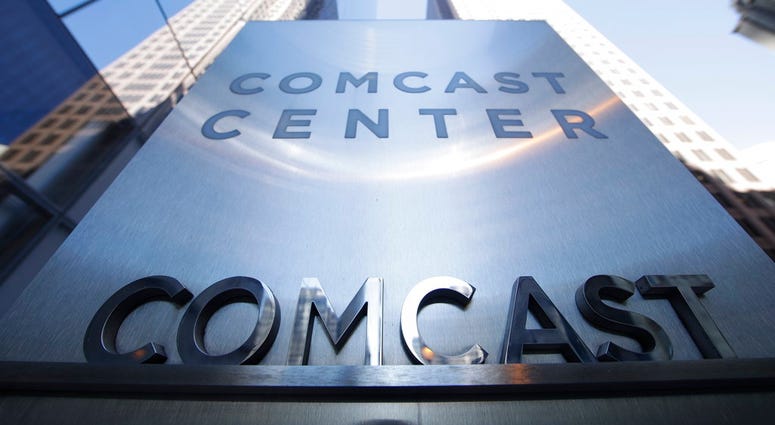 File photo shows a sign outside the Comcast Center in Philadelphia. (AP Photo/Matt Rourke, File) File photo shows a sign outside the Comcast Center in Philadelphia. (AP Photo/Matt Rourke, File)