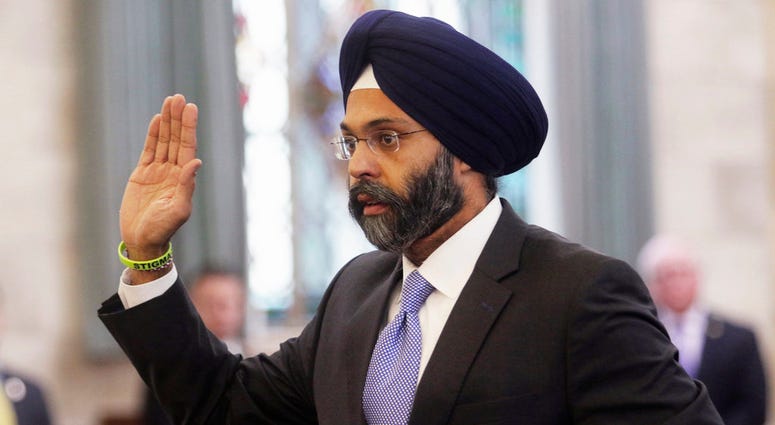 In this Jan. 16, 2018, file photo, Gurbir Grewal is sworn in before testifying in front of the senate judiciary committee in Trenton, N.J. (Chris Pedota/The Record via AP, File)