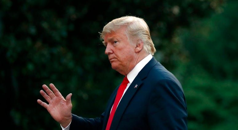 President Donald Trump waves after stepping off Marine One on the South Lawn of the White House, Thursday, July 26, 2018, in Washington. Trump is returning from a trip to Iowa and Illinois. (AP Photo/Alex Brandon)
