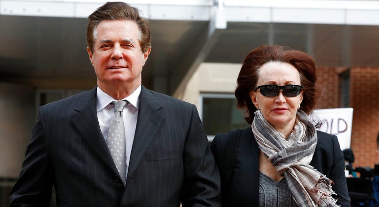 In this March 8, 2018, file photo, Paul Manafort, left, President Donald Trump's former campaign chairman, walks with this wife Kathleen Manafort, as they arrive at the Alexandria Federal Courthouse in Alexandria, Va. (AP Photo/Jacquelyn Martin, File)