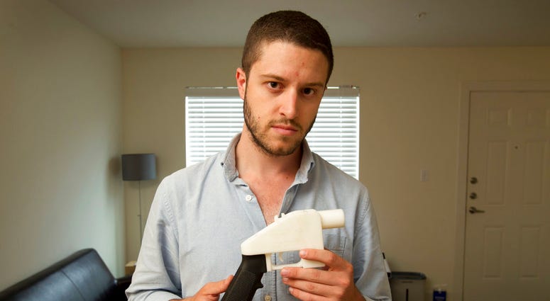 Cody Wilson holding a plastic gun