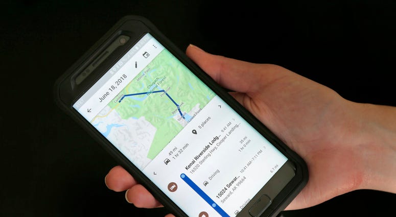 In this Wednesday, Aug. 8, 2018, photo a mobile phone displays a user's travels in New York. (AP Photo/Seth Wenig)