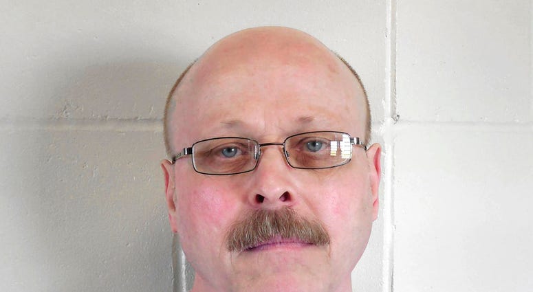 his file photo provided by the Nebraska Department of Correctional Services shows death-row inmate Carey Dean Moore. Nebraska prison officials are preparing to execute Moore on Tuesday, Aug. 14, 2018, for the 1979 murders of two Omaha cab drivers. The exe