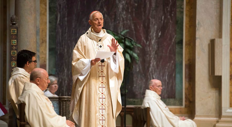 Cardinal Donald Wuerl, Archbishop of Washington, speaks before Mass at St. Mathews Cathedral, Wednesday, Aug. 15, 2018 in Washington. (AP Photo/Kevin Wolf)