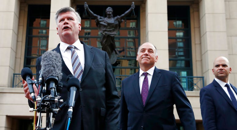 Defense attorney Kevin Downing,, makes a statement outside federal court after closing arguments and jury instructions ended in the trial of the former Donald Trump campaign chairman, in Alexandria, Va., on Aug. 15, 2018. (AP Photo/Jacquelyn Martin)