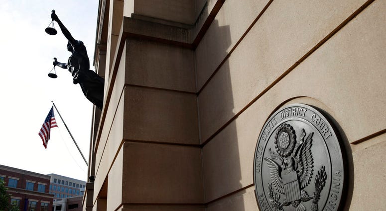 Federal court is seen as the second day of jury deliberations begin in the trial of former Trump campaign chairman Paul Manafort, in Alexandria, Va., Friday, Aug. 17, 2018. (AP Photo/Jacquelyn Martin)