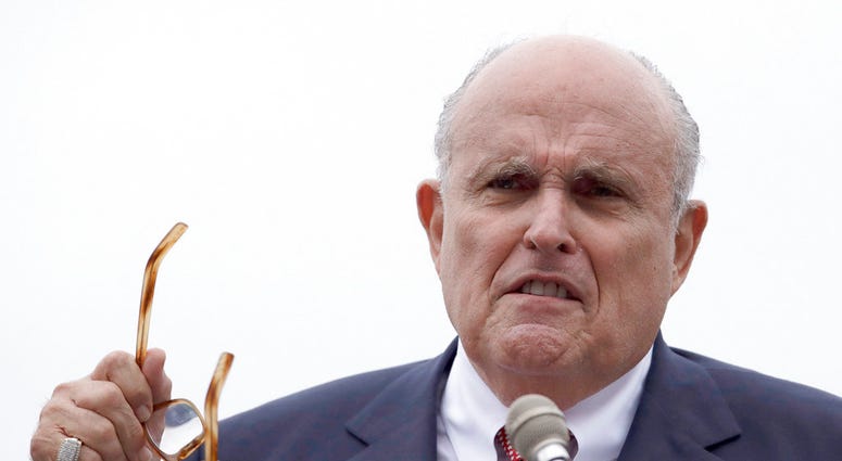 In a Wednesday, Aug. 1, 2018 file photo, Rudy Giuliani, an attorney for President Trump, speaks during campaign event for Eddie Edwards, who is running for the U.S. Congress in New Hampshire, in Portsmouth, N.H.