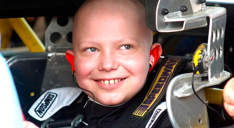 In this Saturday, Aug. 18, 2018, photo, Caleb Hammond, an 11-year-old Iowa boy who wants racing stickers to cover his casket after he dies from leukemia