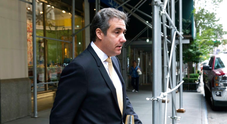 Michael Cohen, former personal lawyer to President Donald Trump, leaves his apartment building, in New York, Tuesday, Aug. 21, 2018. (AP Photo/Richard Drew)