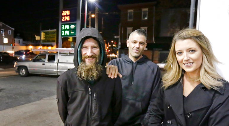 FILE – In this Nov. 17, 2017, file photo, Johnny Bobbitt Jr., left, Kate McClure, right, and McClure's boyfriend Mark D'Amico pose at a Citgo station in Philadelphia. (Elizabeth Robertson/The Philadelphia Inquirer via AP) FILE – In this Nov. 17, 2017, file photo, Johnny Bobbitt Jr., left, Kate McClure, right, and McClure's boyfriend Mark D'Amico pose at a Citgo station in Philadelphia. (Elizabeth Robertson/The Philadelphia Inquirer via AP)