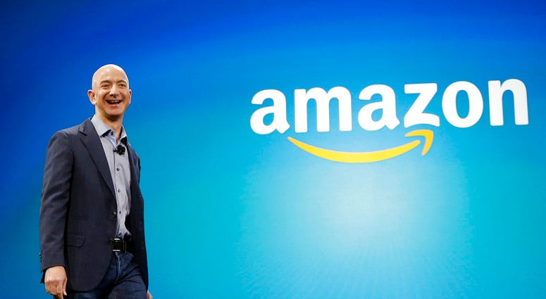In this June 16, 2014, file photo, Amazon CEO Jeff Bezos walks onstage for the launch of the new Amazon Fire Phone,