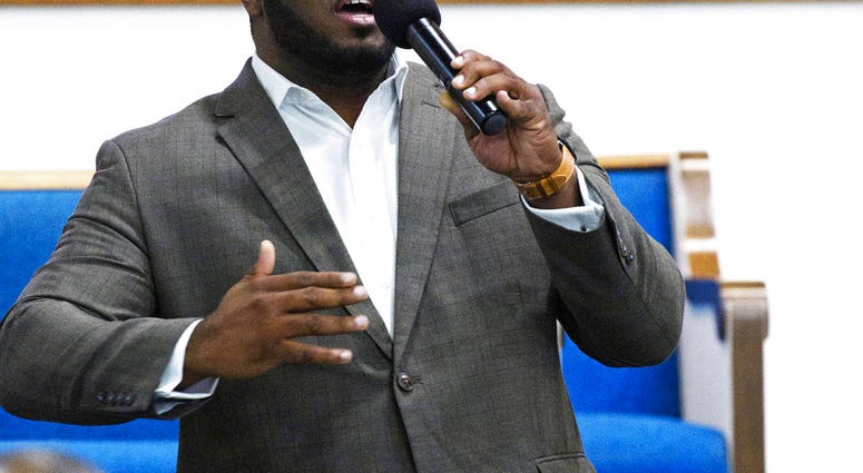 This Sept. 21, 2017, photo provided by Harding University in Search, Ark., shows Botham Jean leading worship