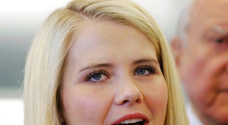 In this July 6, 2017, file photo, kidnapping victim Elizabeth Smart speaks to reporters during a tour of the state crime lab in Taylorsville, Utah