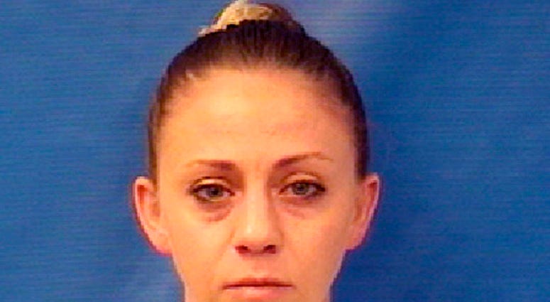 This file photo provided by the Kaufman County Sheriff's Office shows Amber Renee Guyger. Guyger, a Dallas police officer accused of fatally shooting her neighbor