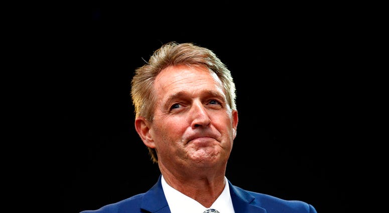 Sen. Jeff Flake, R-Ariz., listens to a question during an appearance at the Forbes 30 Under 30 Summit, Monday, Oct. 1, 2018, in Boston. (AP Photo/Mary Schwalm)