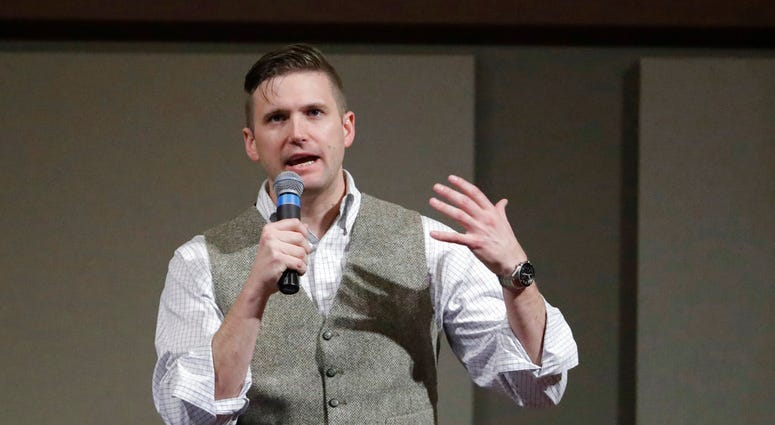In this Dec. 6, 2016, file photo, Richard Spencer, who leads a movement that mixes racism, white nationalism and populism, speaks at the Texas A&M University campus in College Station, Texas. (AP Photo/David J. Phillip, File)